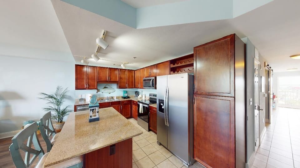 Kitchen is fully stocked with dishes and pot and pots.