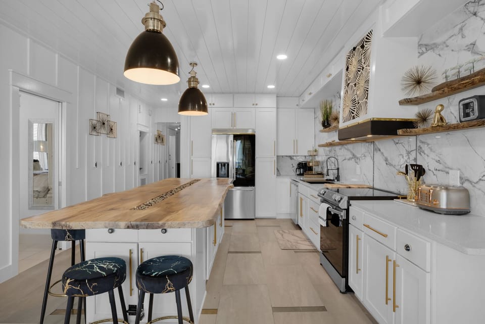 Your chef-worthy kitchen features marble countertops, stainless appliances, and a stunning live-edge island where you'll love preparing meals.