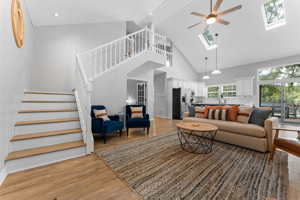 Lots of seating and natural light throughout the home thanks to skylights and big windows leading out onto the back deck
