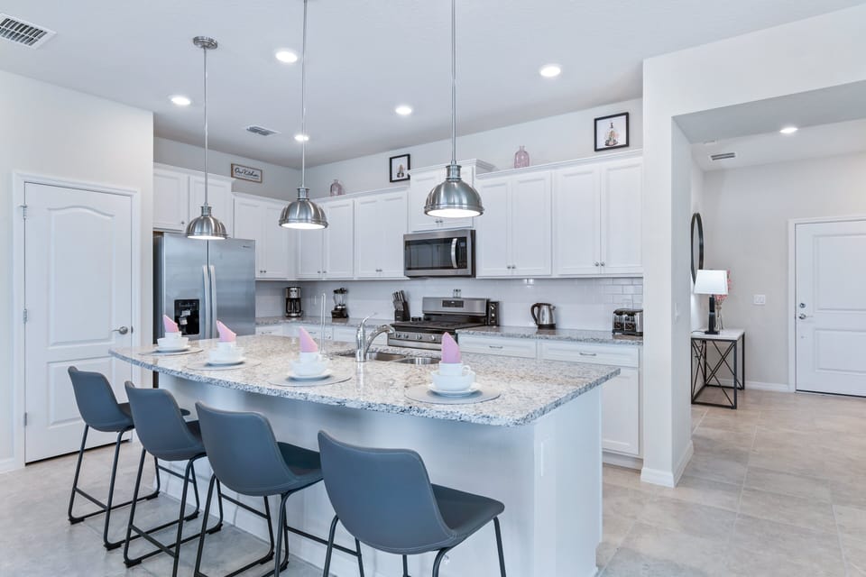 Culinary space featuring a breakfast bar for convenient dining