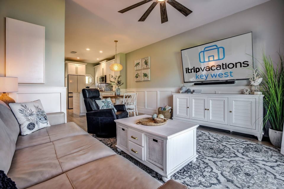Settle in and unwind with a cozy movie night in the comfortable living room, providing the perfect space for relaxation and entertainment.