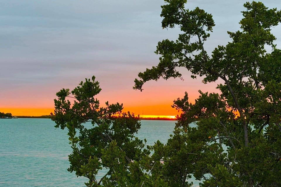 Facing west, Tipsy Turtle offers stunning sunset views with vibrant colors reflecting over the water each evening.