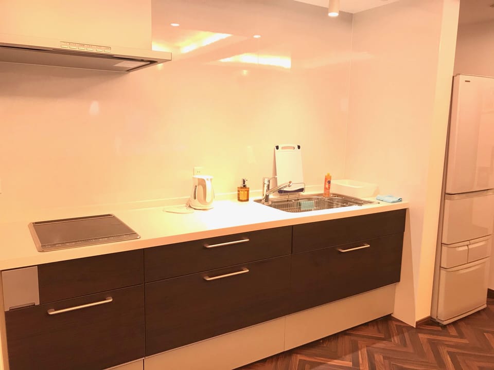 Family House | Private kitchen | Fridge, electric kettle, highchair, dining tables