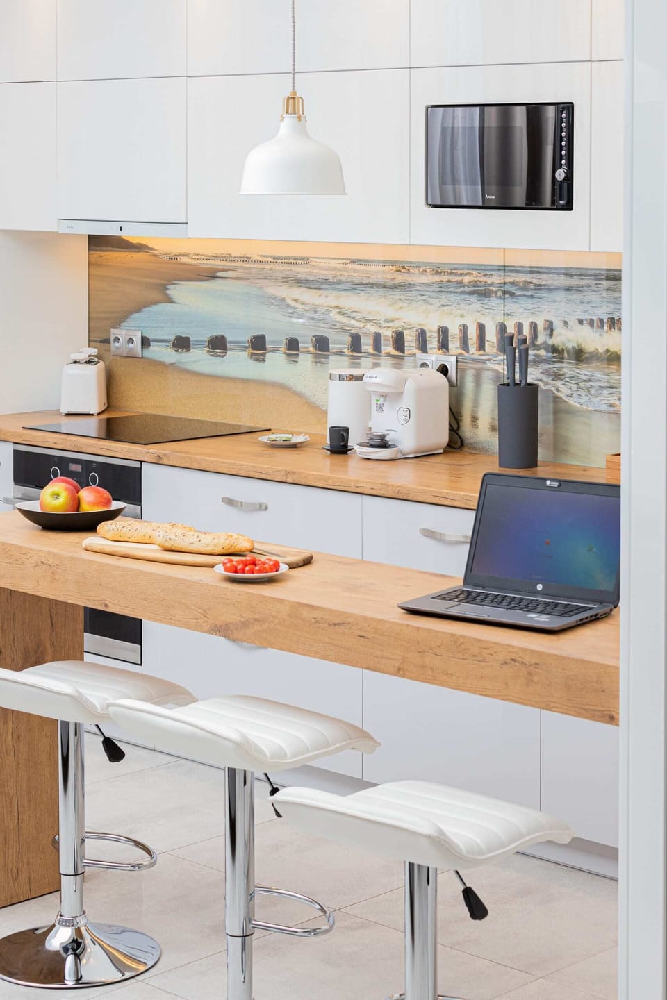 Kitchenette with oven and refrigerator. 