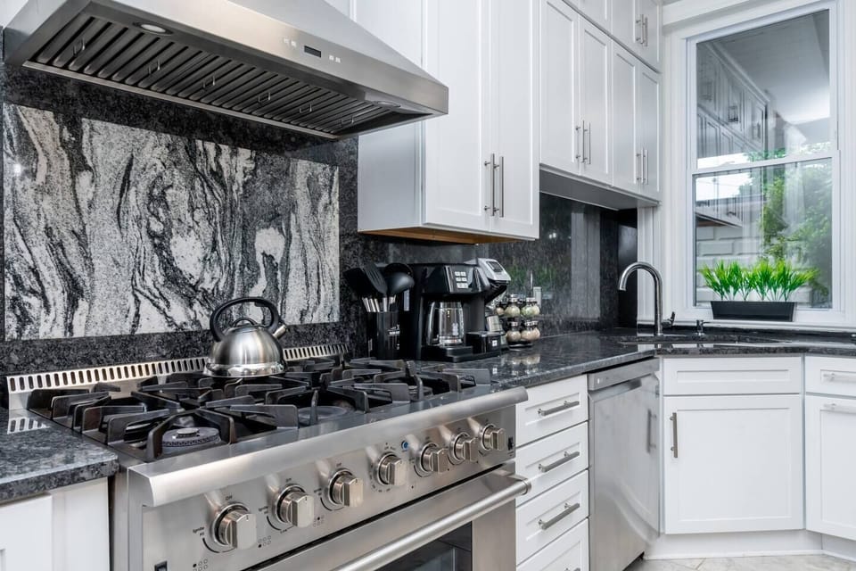 Fully stocked kitchen with top-of-the-line Thermador high-end range, dual coffee machine and more. 