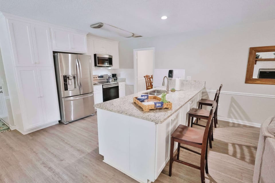 Full kitchen view with bar seating!