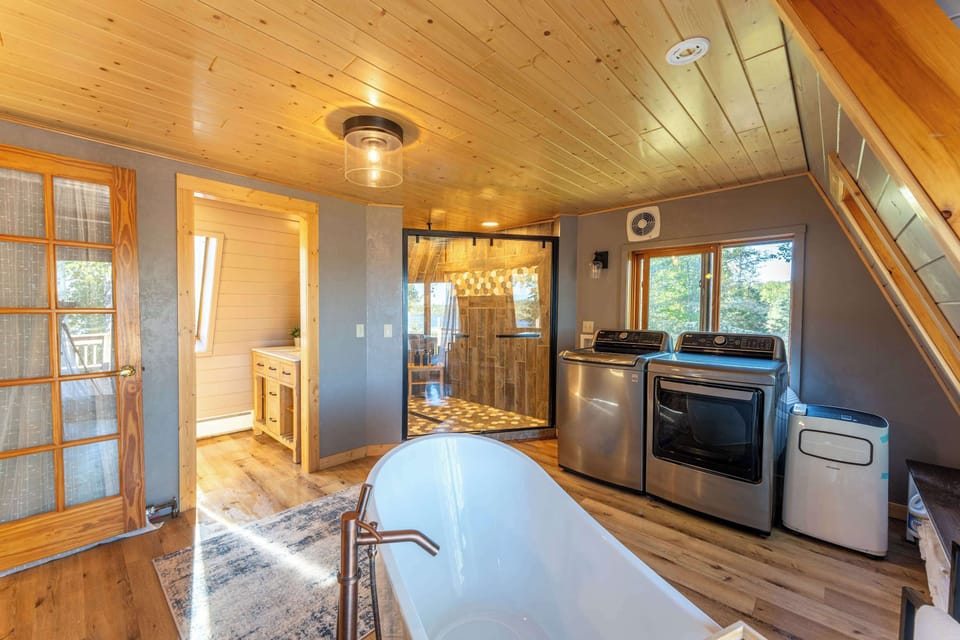 Bathroom includes washer and dryer. 
