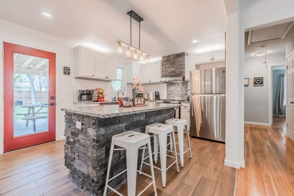 Open kitchen area, access to patio from kitchen