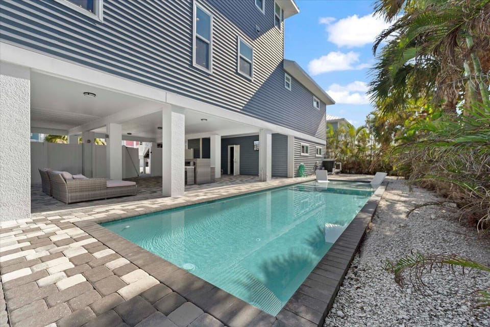 Relax and entertain in the spacious pool area with cozy outdoor furniture, a TV, and a BBQ—your perfect outdoor oasis!