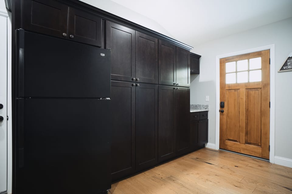 Mud room to place belongings upon entering plus an extra refrigerator of space. 