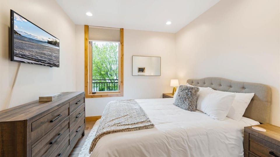 Junior master bedroom includes a luxury queen mattress and linens, HDTV with streaming capabilities, closet