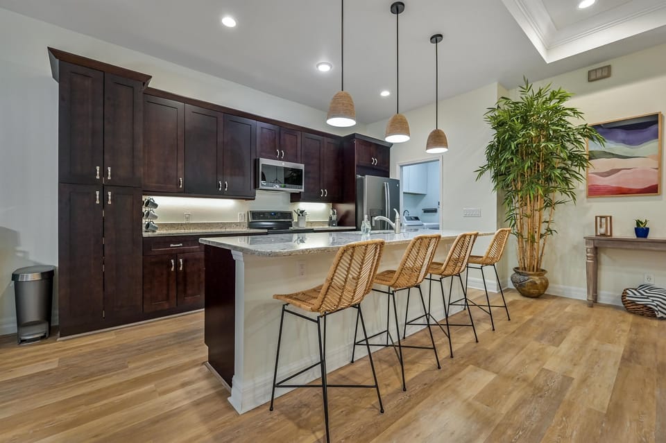 Kitchen island offers visitors to engage in conversations while meals are being prepped