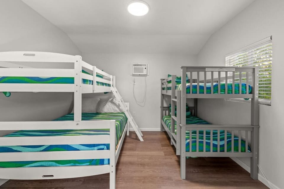 Poolside casita / fourth bedroom located off the poolside path. Features a smart Roku TV, 2 bunk beds. 1 tw/tw and 1 tw/full. This room sleeps 5.