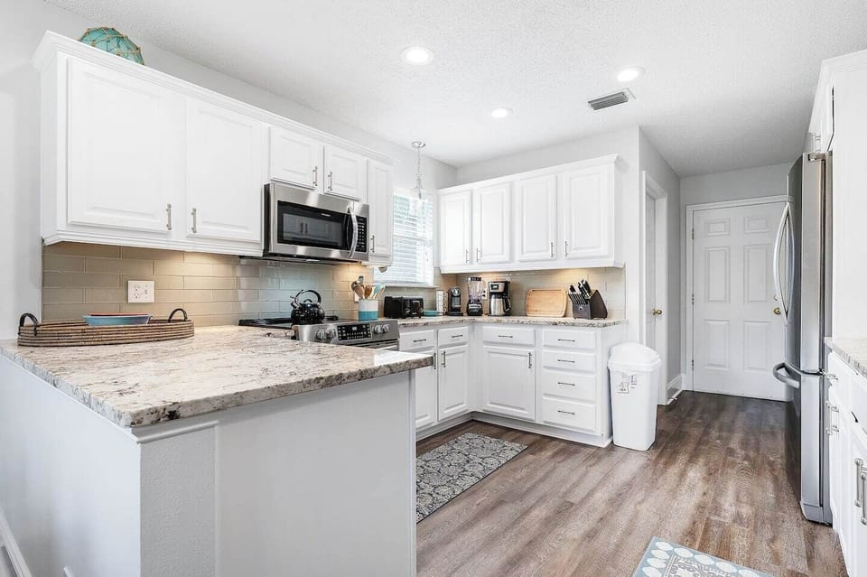 Kitchen area has enough space  to move comfortably from kitchen to dining.