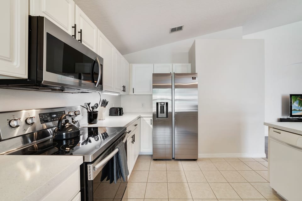 Well appointed spacious kitchen | Modern stainless appliances