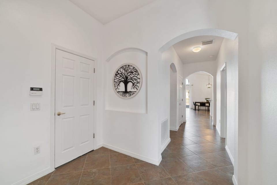 Main hallway with high ceilings | Beautiful diamond pattern tile floors
