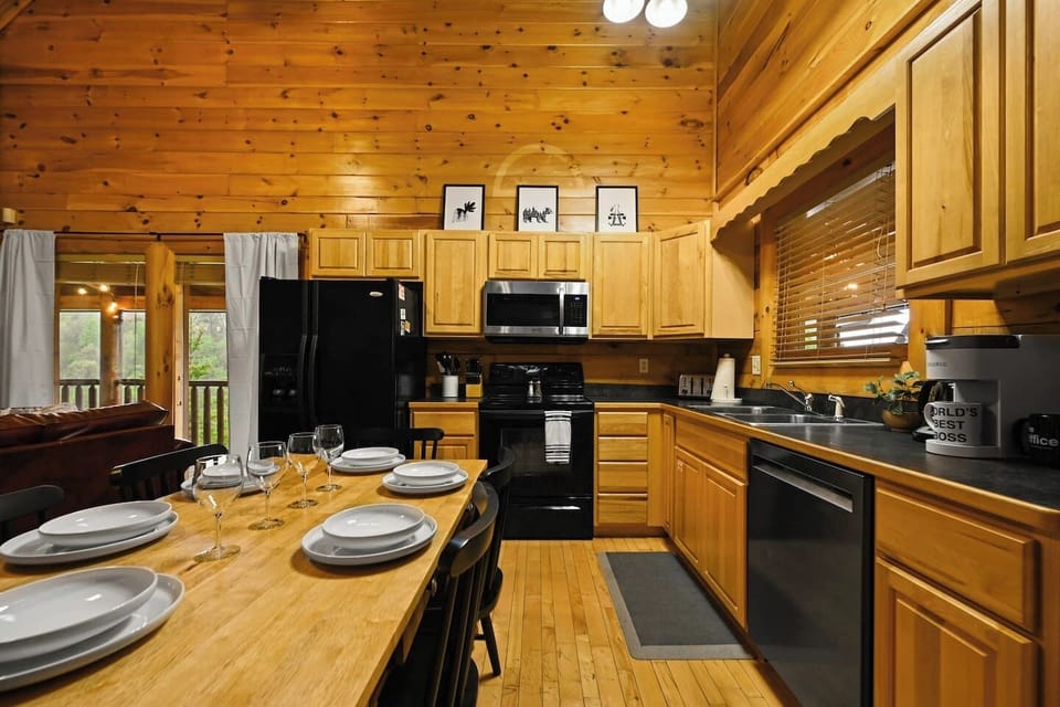 This is the kitchen and eating area - stocked full of essentials to make sure you have a comfortable trip in the Smokies. There's nothing like a great family meal after a day of having fun!