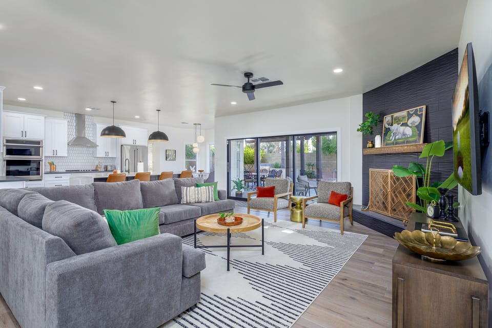 Spacious living room with retractable sliding glass door. 
