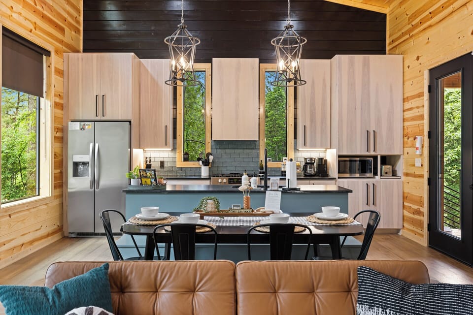 Kitchen with modern stainless steel appliances and all the essentials provided for your stay.