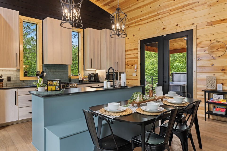 Gather around for memorable meals and great conversation at our dining room table, seamlessly integrated into the open-concept kitchen and living room for a warm, inviting atmosphere.