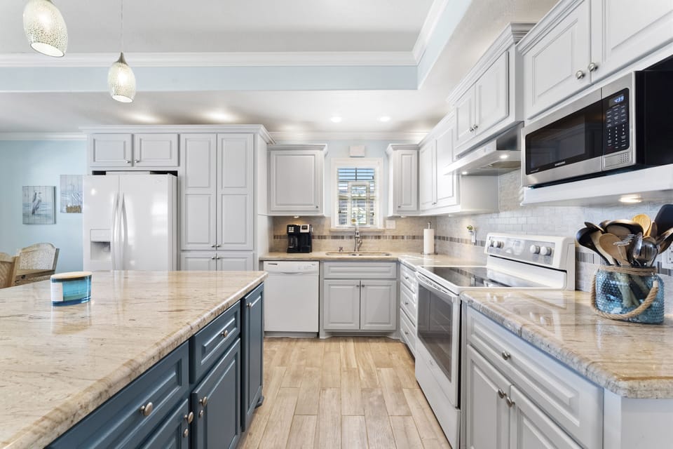 This large kitchen is well stocked and has plenty of county space. 