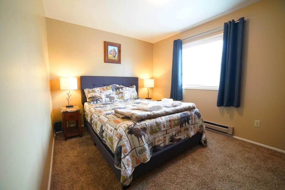 The second upstairs bedroom also has a queen bed and a large closet.