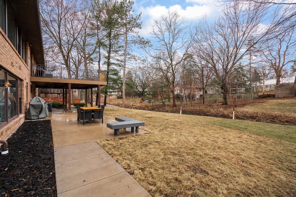 Your private backyard oasis awaits with spacious lawn, covered patio dining, and BBQ area perfect for outdoor entertaining.