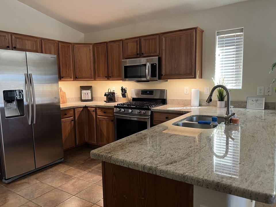 Gourmet kitchen w/high end appliances, granite countertops + all the essentials 