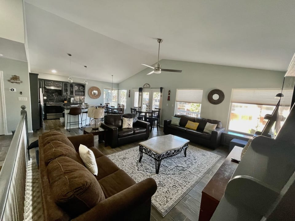 spacious living room with window view to front balcony.