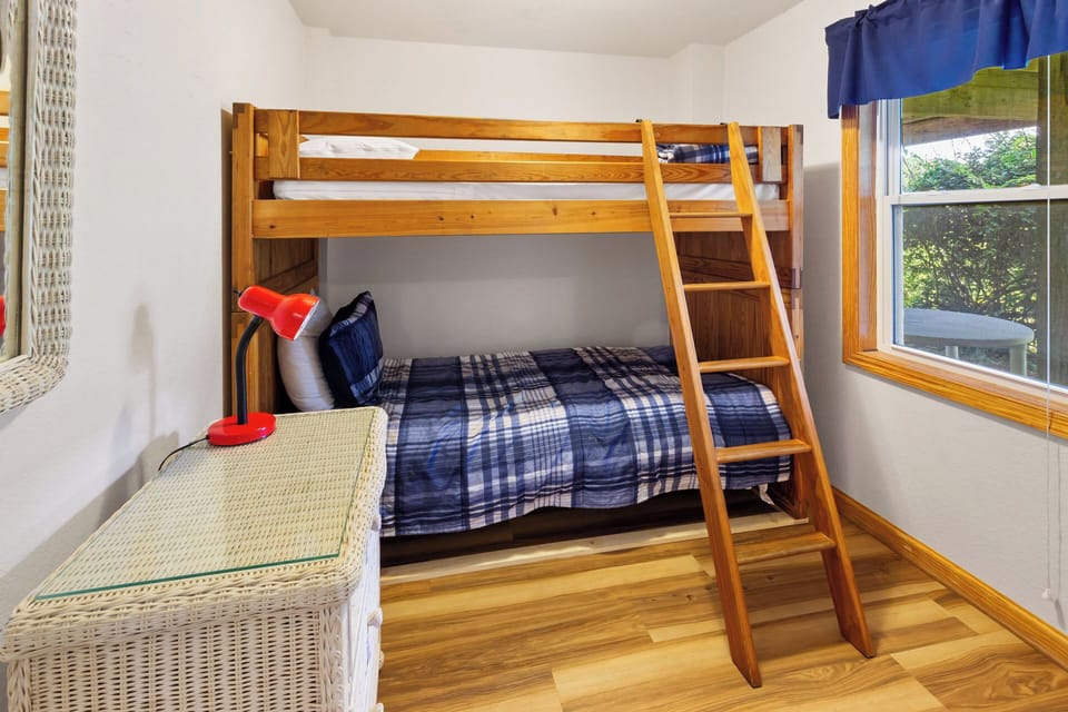 The Ground-Level Bedroom with a Pyramid Bunk and Trundle offers even more space for the kids to have their own room.