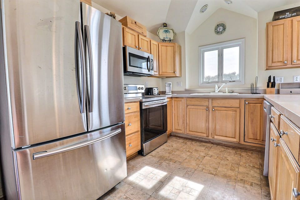 Use the Flat Top Stove in the modern Kitchen to create a gourmet masterpiece to enjoy in one of the two Dining Areas or at the Breakfast Bar.