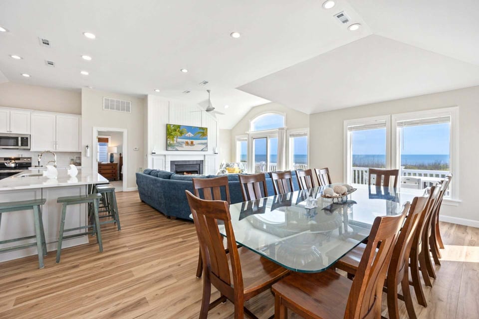 Relax on the Top Level with lots of natural light and brilliant views of the Atlantic Ocean. (New 75" TV & Redesigned Fireplace!)