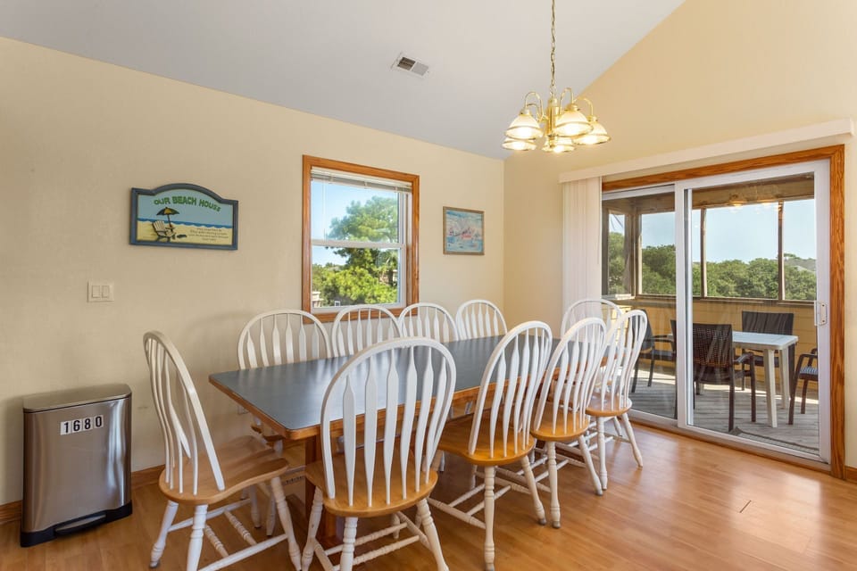 Eat together in the Dining Area adjacent to the Screened-In Porch.