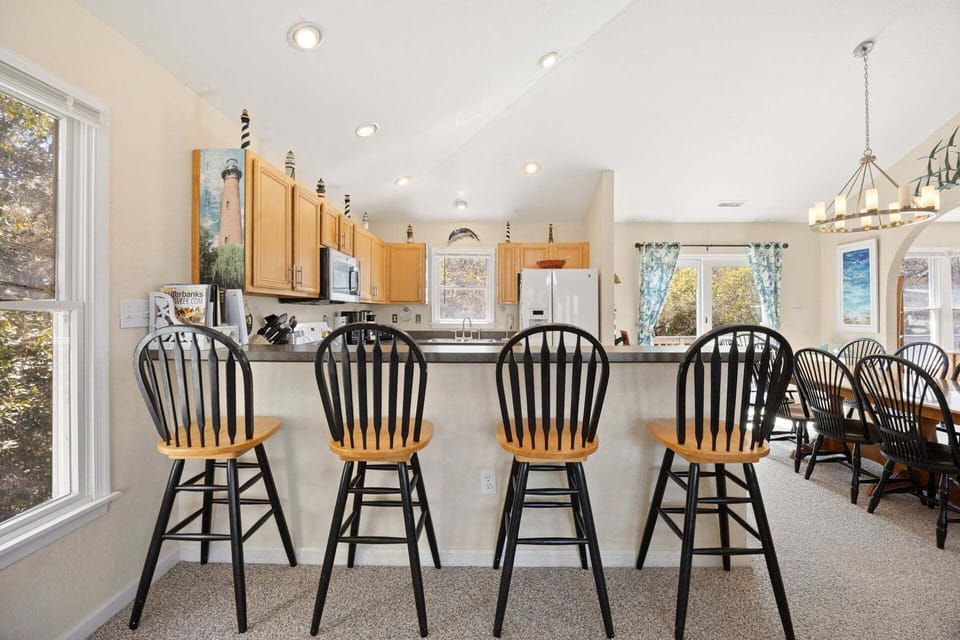 The open kitchen layout allows easy conversation while preparing meals.
