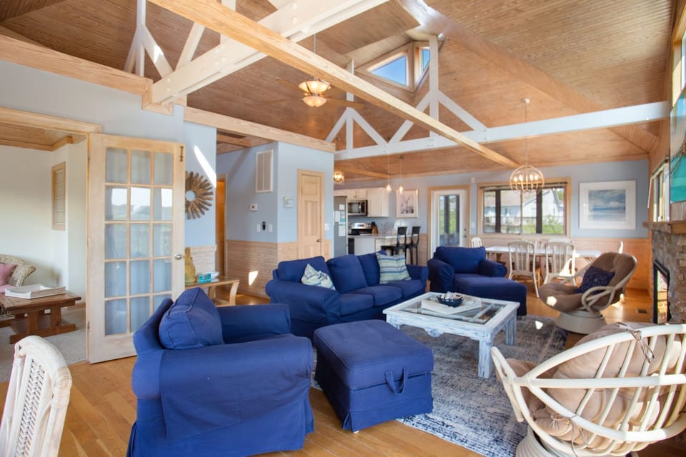 Relax in the spacious Living Area with expansive vaulted ceilings and a Flatscreen TV!