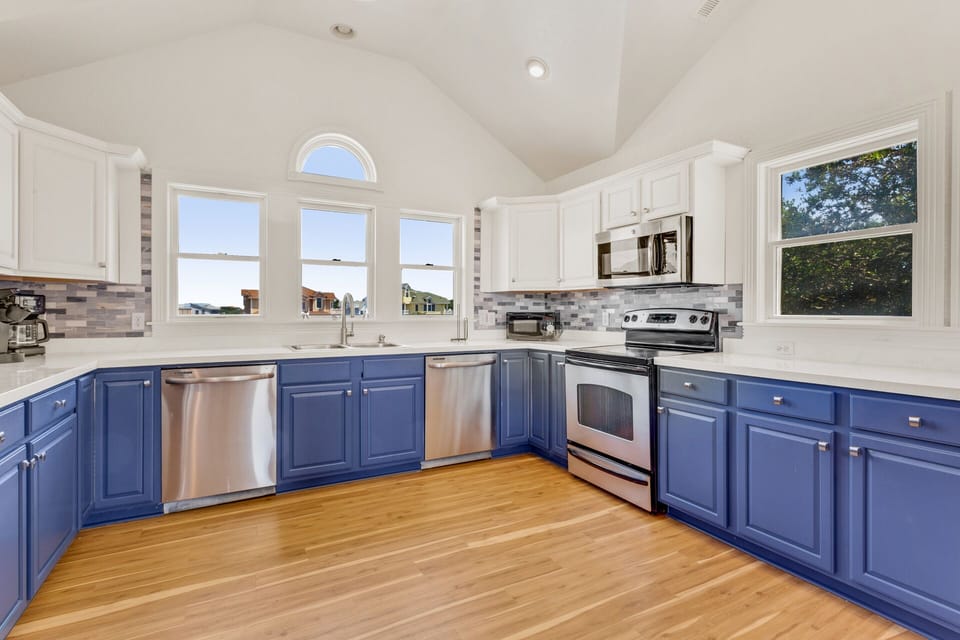 Whip up something delicious in the Kitchen with a Counter Bar on the Top Level.