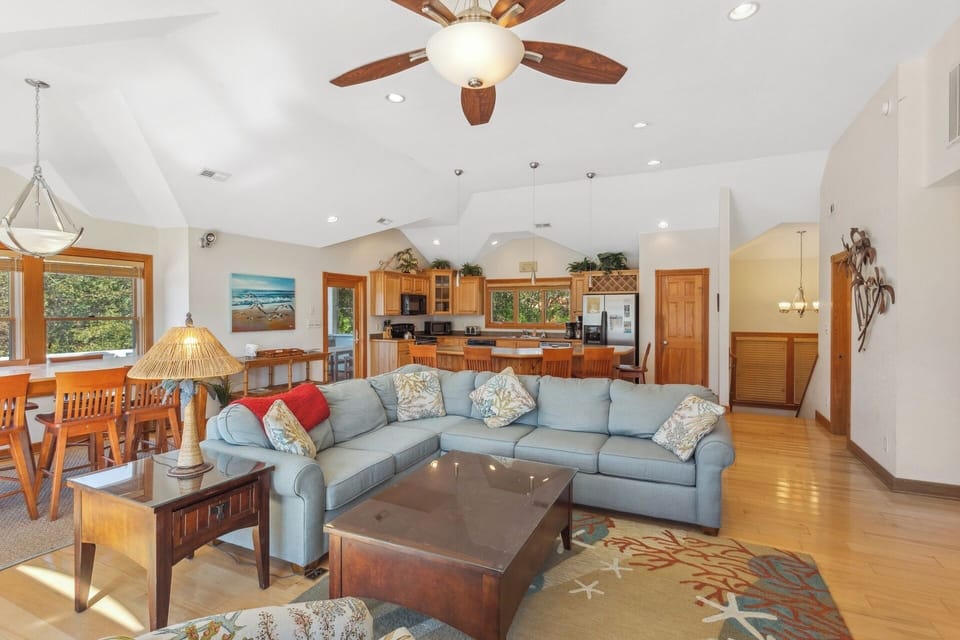 Gather together in the large Living Area with Cathedral Ceilings and a Fireplace for a movie night around the Flat Screen TV