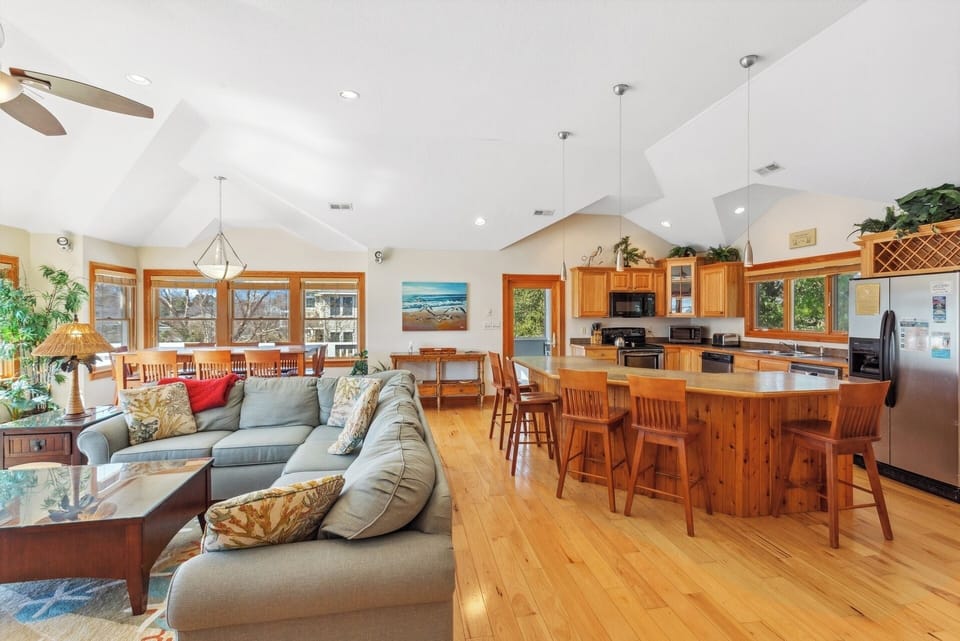 Gather together in the large Living Area with Cathedral Ceilings and a Fireplace for a movie night around the Flat Screen TV