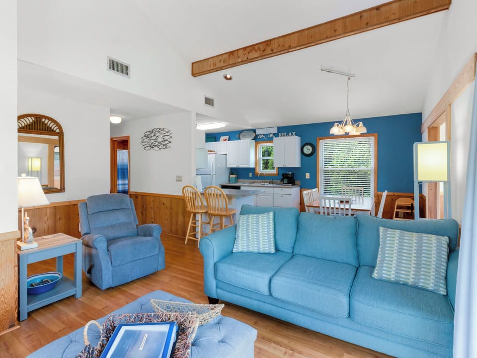 Relax in the Top-Level Living Area with lots of natural sunlight.