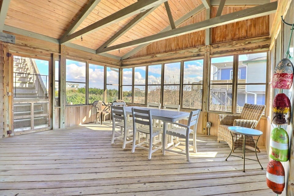 The screened porch provides a shaded, breezy spot to enjoy morning coffee or evening cocktails.