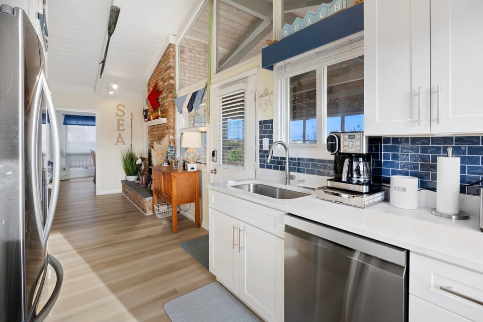 The fully equipped kitchen offers classic styling and everything needed to prepare meals during your stay.
