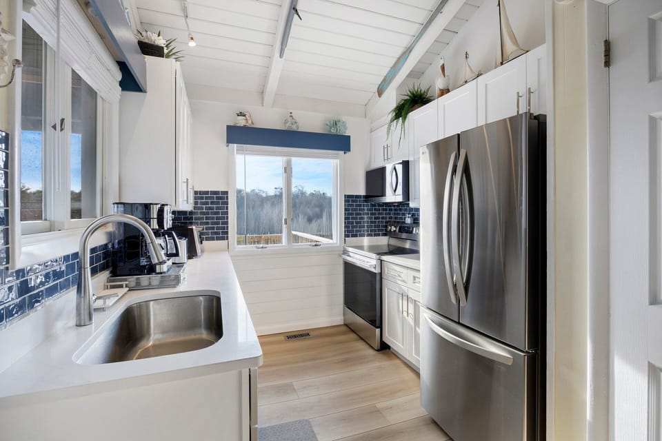 The fully equipped kitchen offers classic styling and everything needed to prepare meals during your stay.