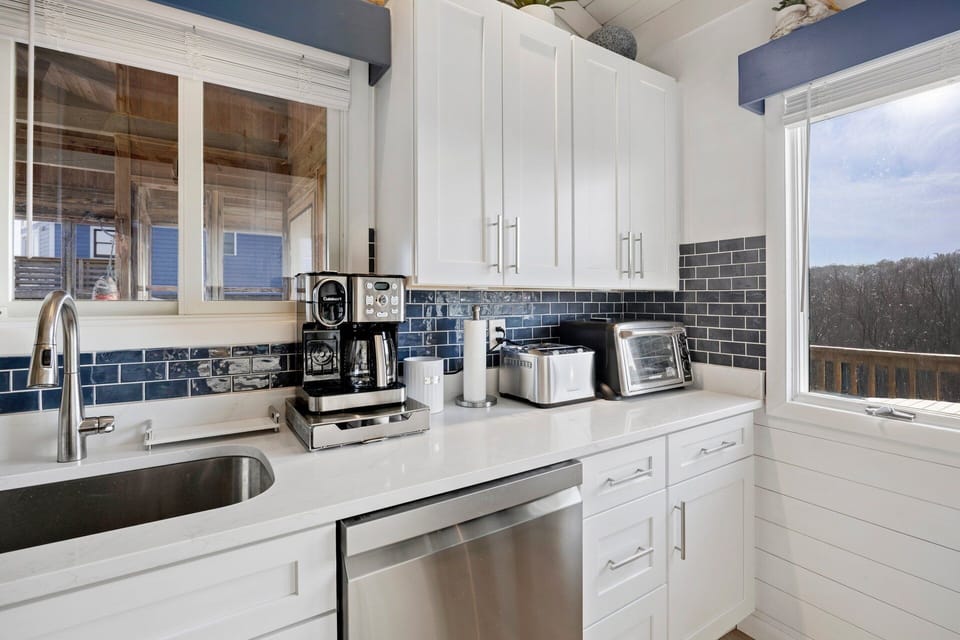 The fully equipped kitchen offers classic styling and everything needed to prepare meals during your stay.