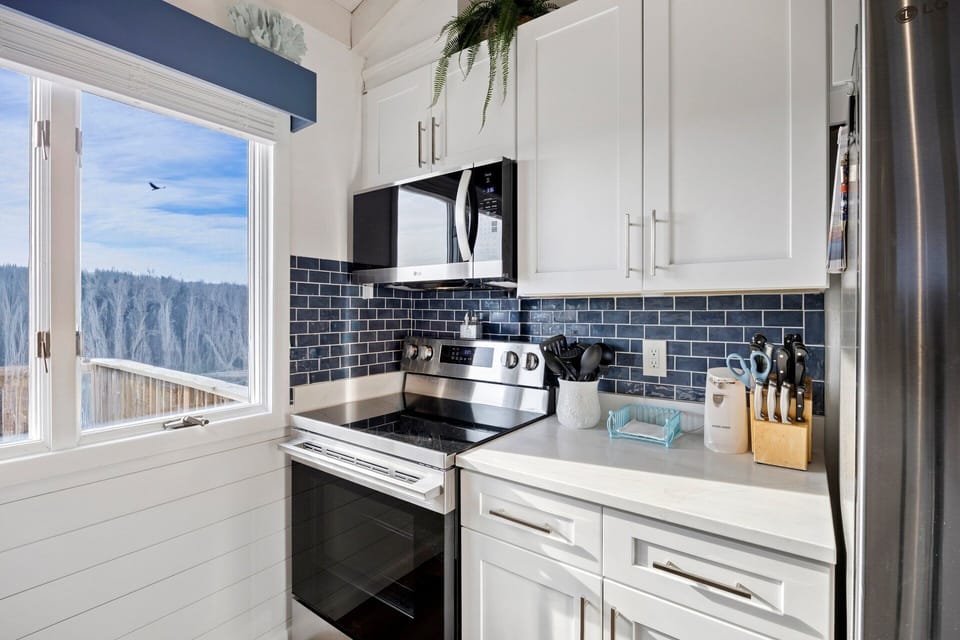 The fully equipped kitchen offers classic styling and everything needed to prepare meals during your stay.