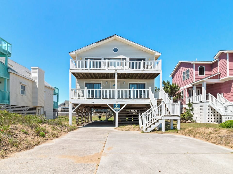 Enjoy breezy days with your toes in the sand at this inviting 4-Bedroom, 2.5-Bathroom vacation home that features fantastic ocean views and a suite of inviting extras.