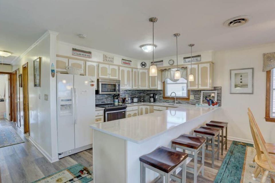 Test your skills in the upgraded Kitchen complete with quartz countertops, stainless steel stove, and microwave.