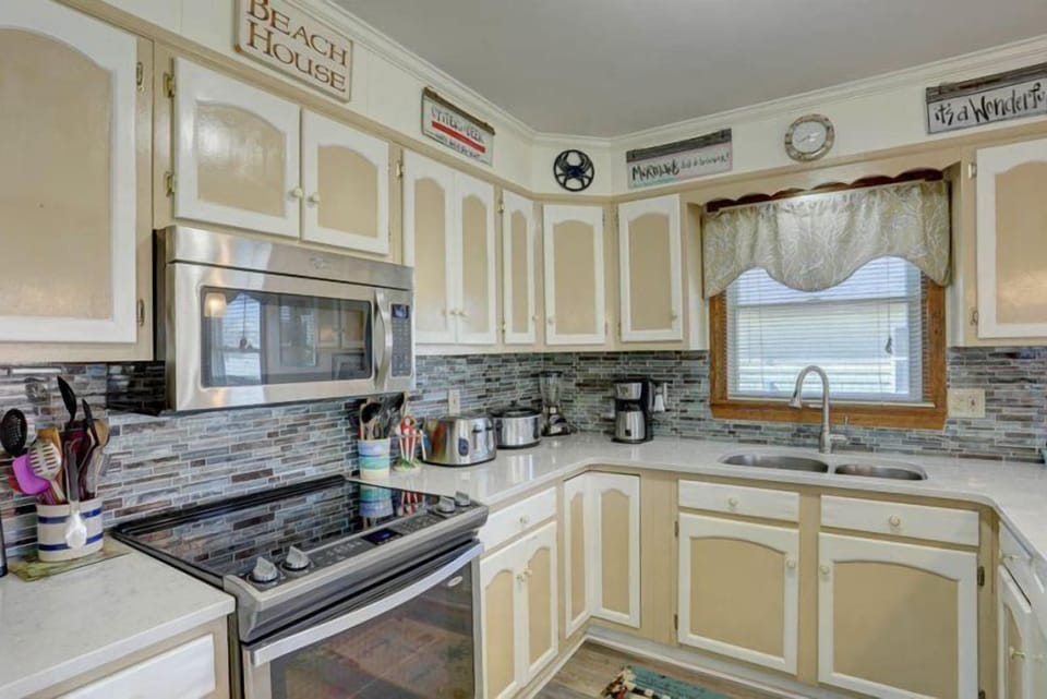 Test your skills in the upgraded Kitchen complete with quartz countertops, stainless steel stove, and microwave.