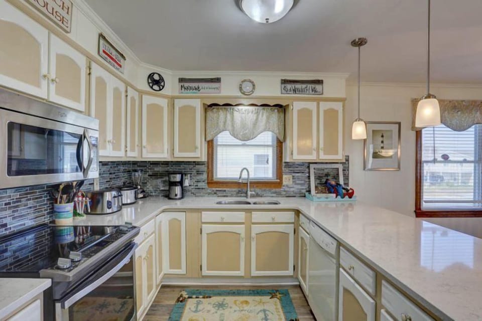 Test your skills in the upgraded Kitchen complete with quartz countertops, stainless steel stove, and microwave.