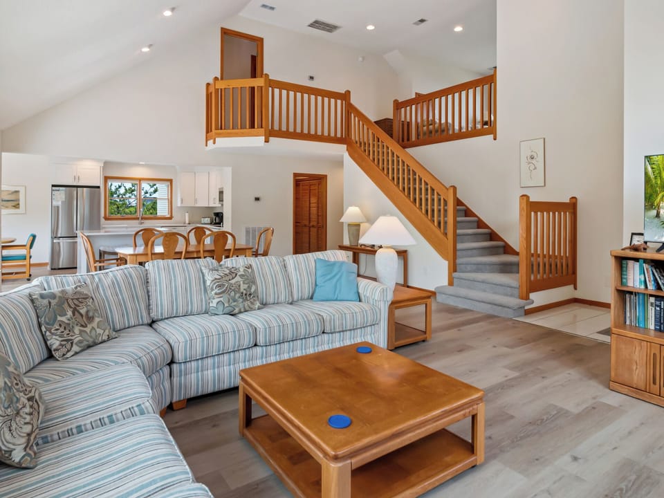 Effortlessly relax in the spacious Great Room with cathedral ceilings.