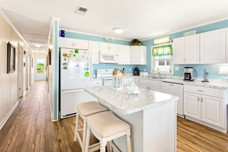 Kitchen: A fully stocked kitchen with a new stove (2022) makes meal prep a breeze.